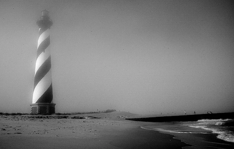 800px-cape hatteras lighthouse in fog%2c on beach in original location. 1998. outer banks%2c north carolina %2834485448691%29