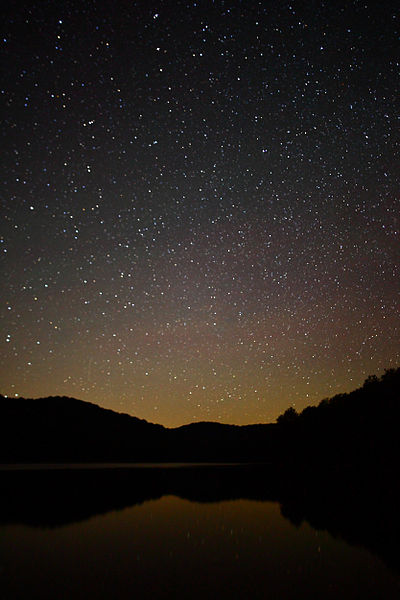 400px-stars in the night sky reflecting in summit lake%2c west virginia - 4 july 2010