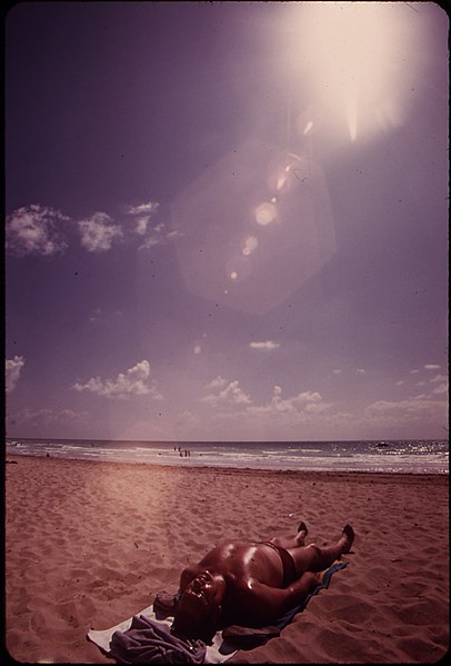 406px-sunbathing at south beach%2c a popular retirement center - nara - 548624