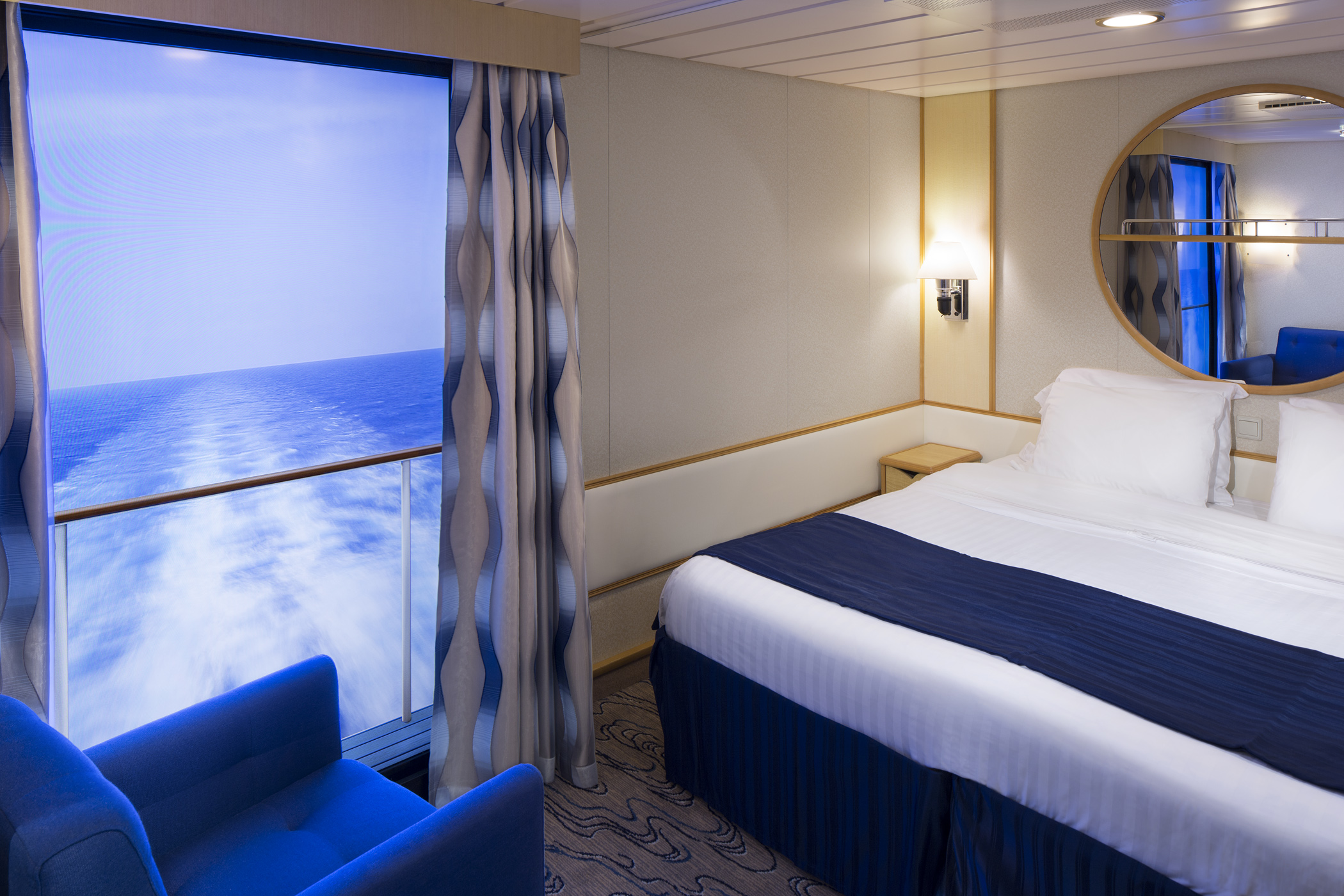 Image of Inside Cabin with Virtual Balcony, sourced from: Royal Caribbean International https://touristwire.com/wp-content/uploads/2023/05/Virtual_Balcony_Image.jpg