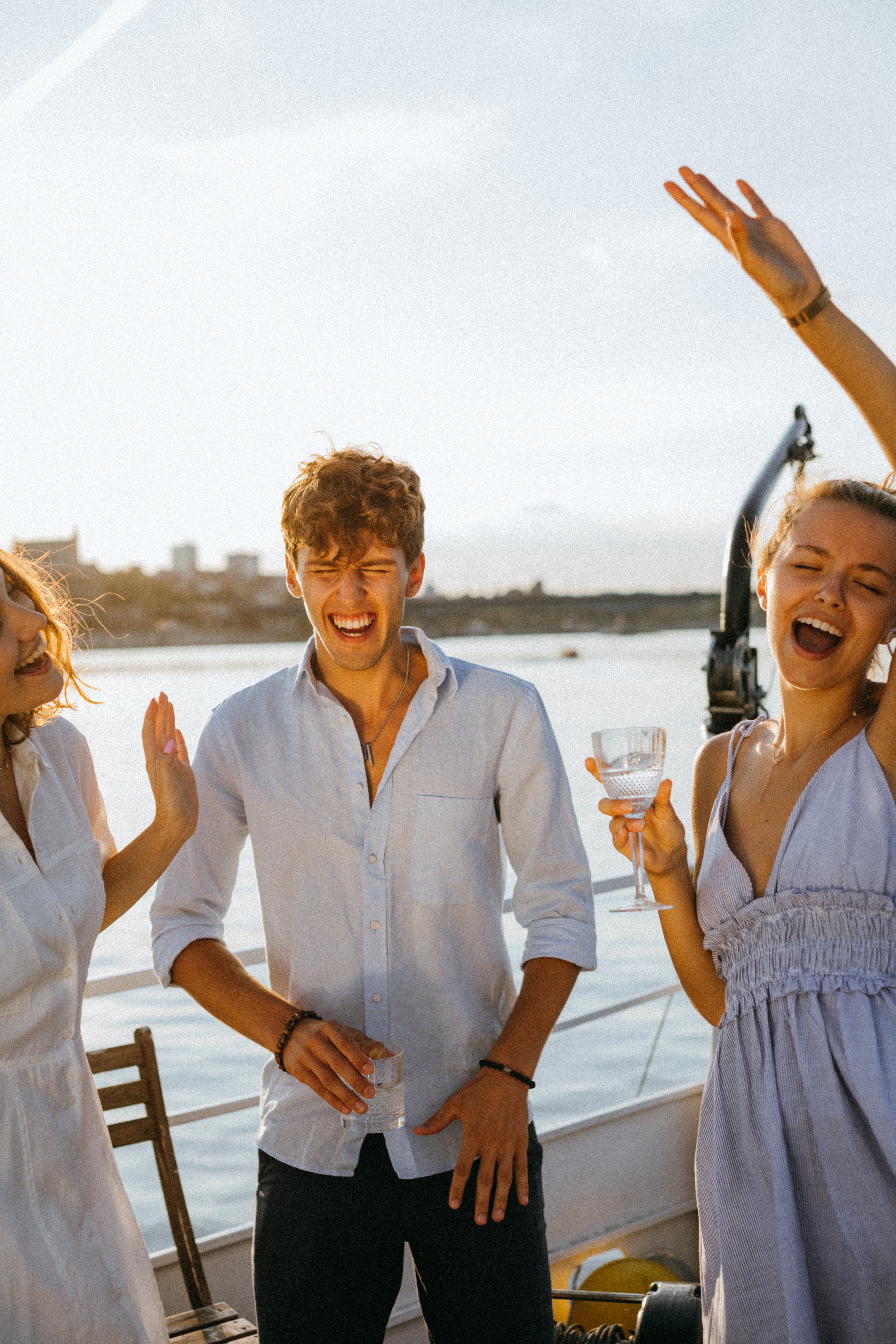 Free Group of Friends Partying on a Yacht Stock Photo