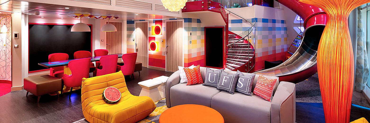 Image of Ultimate Family Suite, sourced from: Royal Caribbean International https://touristwire.com/wp-content/uploads/2023/05/ultimate-family-suite-living-room-slide.jpg