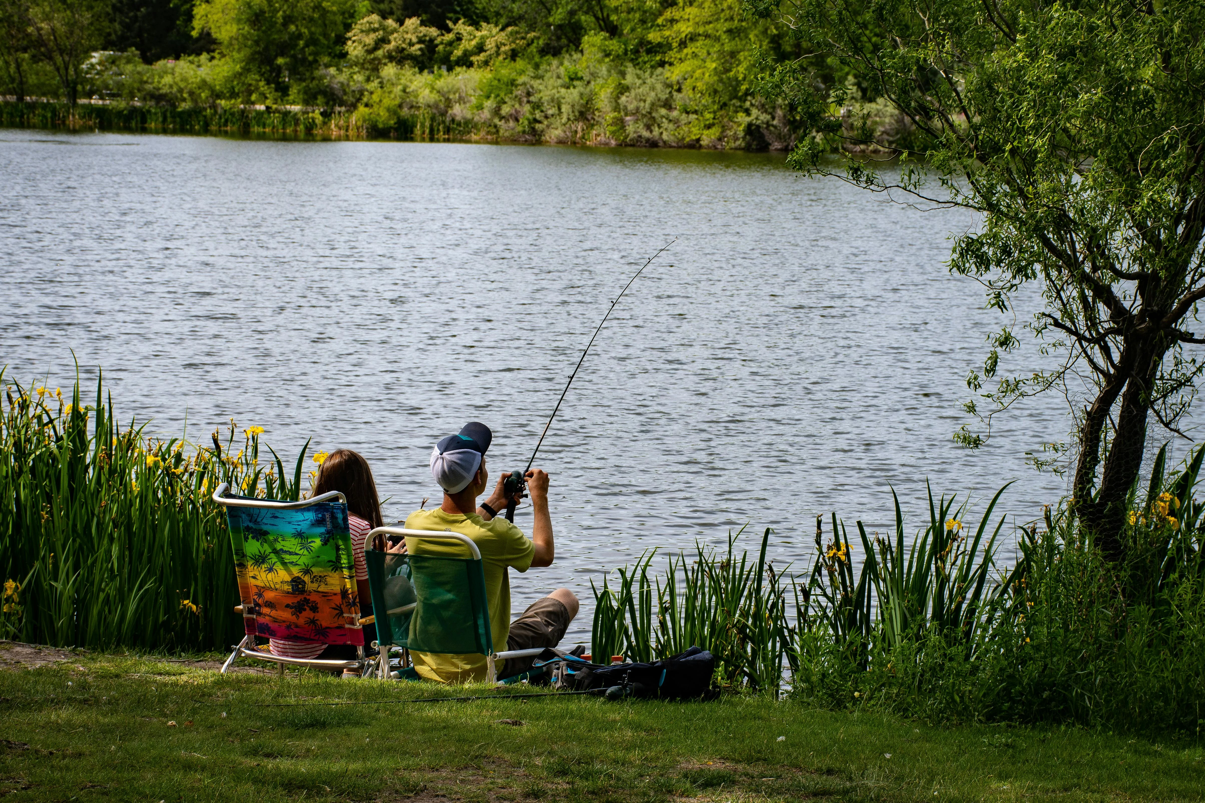 Free Fishing Man Wearing Yellow Shirt Stock Photo