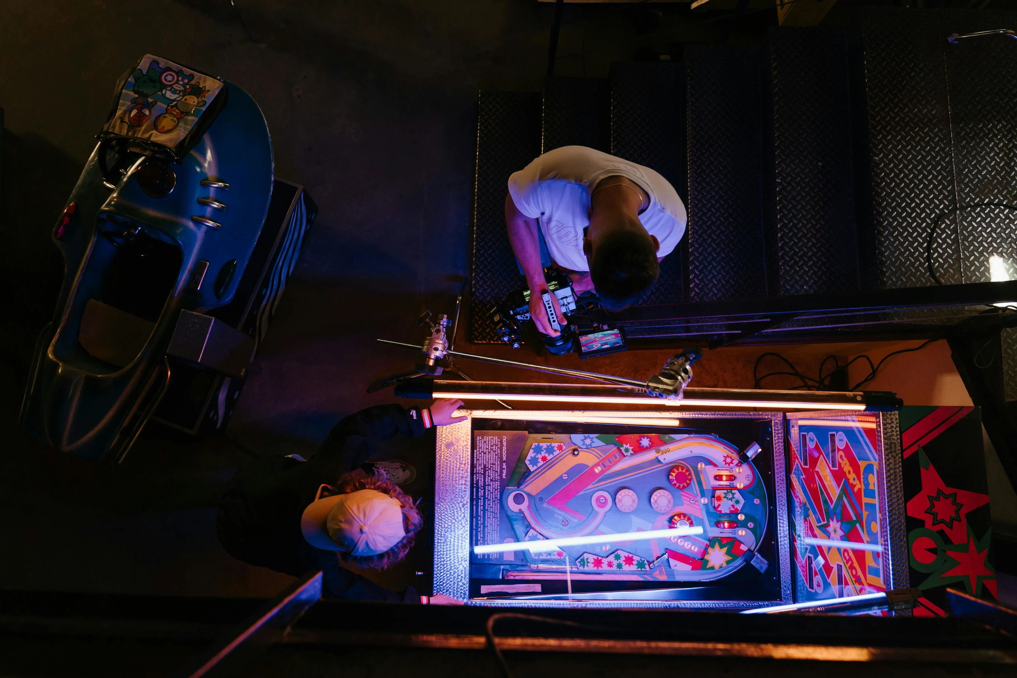 Free Man in White T-shirt Playing Arcade Game Stock Photo