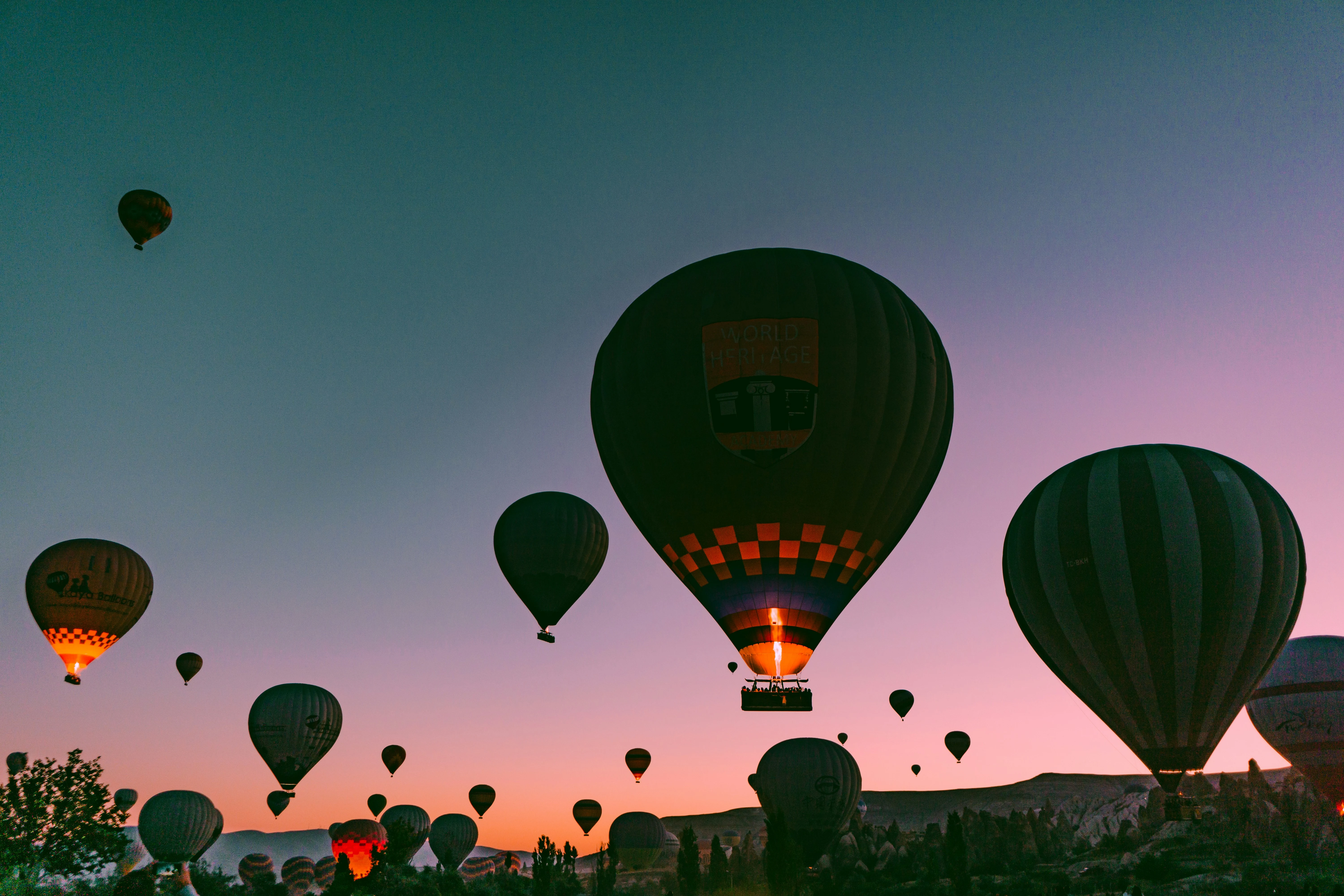 photo 1566682372561 2273e5226306ixlibrb 4.0 hot-air balloon during golden hour